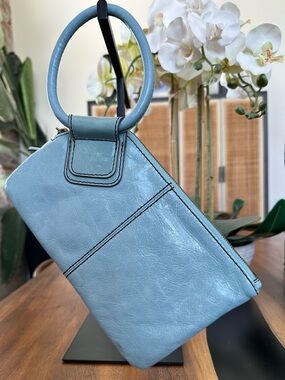 Hobo Sable Wristlet, a classic piece w/a signature circular handle Blue Leather